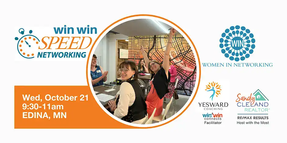 Women in networking event with smiling women engaging and exchanging ideas.